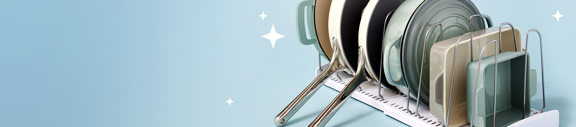Dish rack with plates and bowls on a light blue background