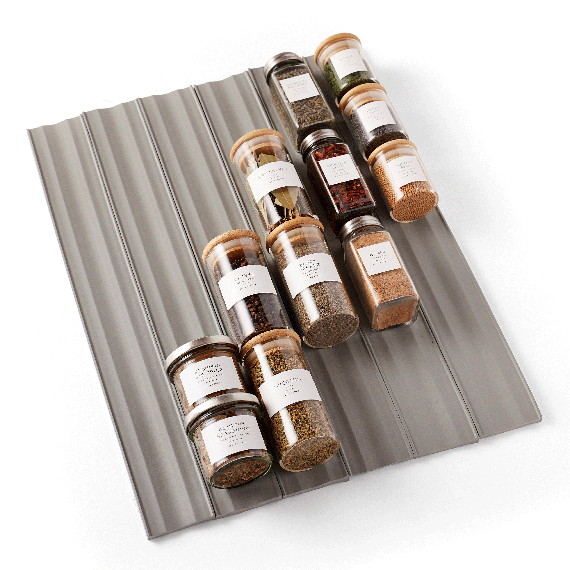spiceliner spice drawer liners with spice jars organized on a white background