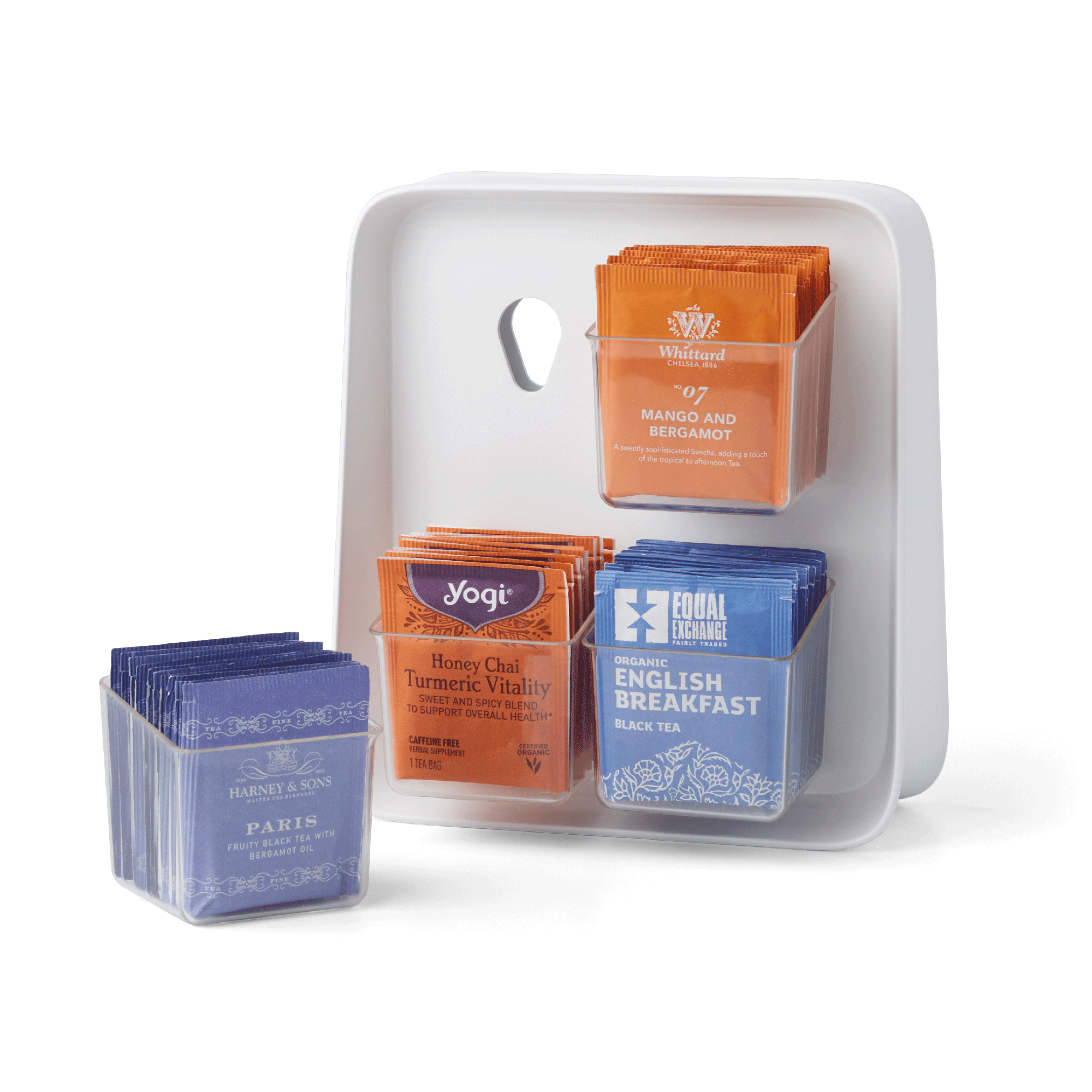 Tea bag organizer with various tea bags including Yogi, Equal Exchange, and Harney & Sons.